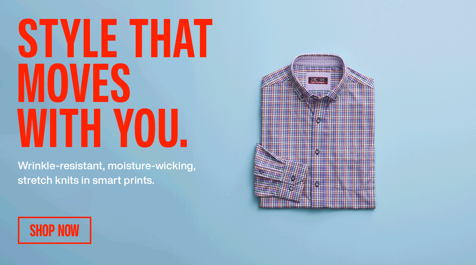 A woman sitting on stone steps dressed in a blue blazer, white pants, and a light tan colored woven loafer.